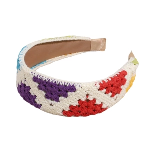 Handmade crochet wide headband with colorful floral knit pattern for women on white background