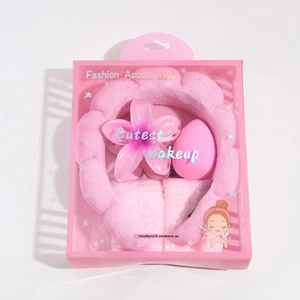 Detailed pink spa headband and wristband set in cute gift packaging with beauty blender