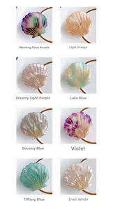 Detailed grid of shell-shaped acetate hair claws with gold stripes in eight elegant colors