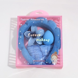 Blue plush headband and wristband set with flower clip and sponge in a pink gift box