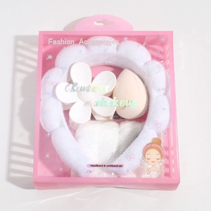 Pink plush headband and white wristband grooming set in a decorative gift box