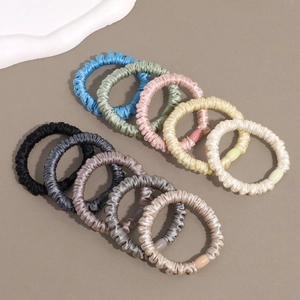 Set of 10 solid color satin scrunchies in various soft pastel tones for women hair styling