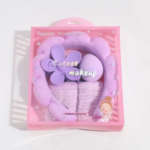 Detailed gift set view featuring purple plush headband, wristbands, and skincare tools