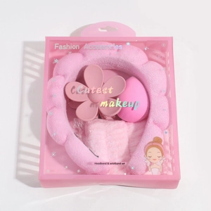 Detailed pink beauty set in a gift box with plush headband, wristbands and accessories