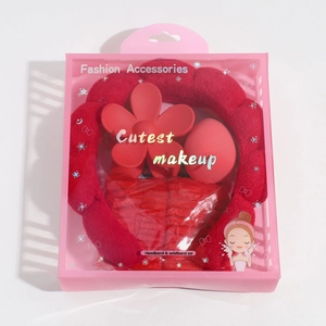 Red sponge headband set with hair claw and wristbands in a gift box for spa and makeup