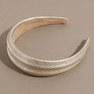 Close-up of champagne gold snakeskin texture wide headband with soft non-slip lining