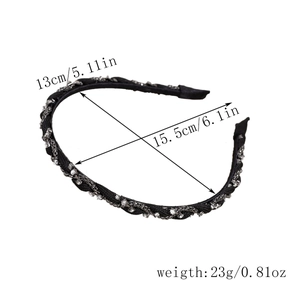 Macro detail of French vintage black headband with size dimensions of 13cm by 15.5cm
