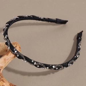 Detail of French vintage black twisted headband with silver chain and rhinestones