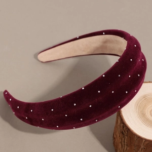 Detail of burgundy velvet headband with sparkling rhinestones and non-slip lining