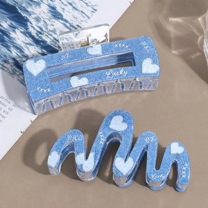 Blue denim texture hair claw clips set with white heart patterns and lucky prints