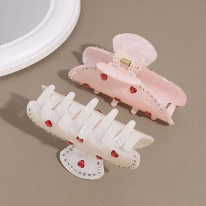 Pince à cheveux élégante avec cœur et strass en rose et blanc à texture marbrée