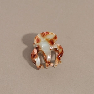 Detail of tortoise shell acetate hair claw with France Handmade gold lettering