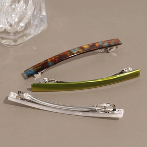 Three-piece French acetate hair clips set with chic marble patterns and gold metal brand tag