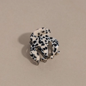 Polka dot acetate hair claw clip with France Handmade gold lettering on beige background