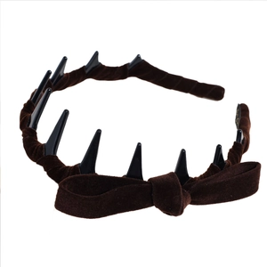 Gothic brown velvet headband with bow and black spikes for a vintage punk look