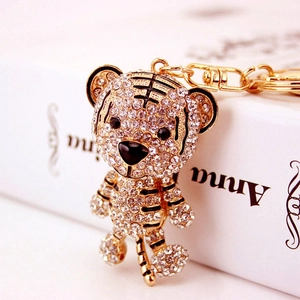 Creative tiger shaped metal keychain with gold plating and sparkling white rhinestones