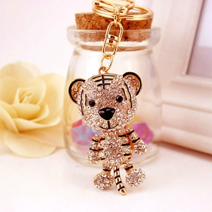 Creative tiger keychain in golden alloy with rhinestones and black enamel stripes