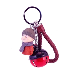 Porte-clés figurine grand-père avec cloche étoile rouge et lanière en cuir tressé marron