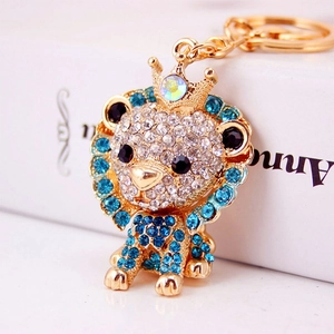 Sparkling blue lion crown keychain with crystal rhinestones on a gold alloy base
