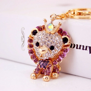 Cute lion keychain with white and purple rhinestones and golden crown decoration