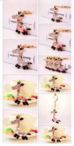 Detail of colorful giraffe keychain with sparkling rhinestones and gold-plated finish