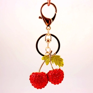Sparkling red rhinestone cherry keychain with gold metal plating and lobster clasp