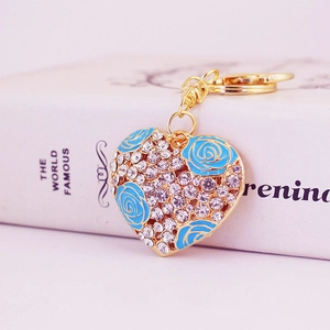 Sparkling crystal heart keychain with blue roses on golden base for handbags