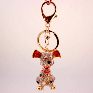 Porte-clés chien à pois scintillant avec strass brillants sur métal doré poli