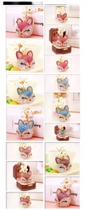 Detail view of fox head keychain with rhinestones and faux pearls in multiple colors