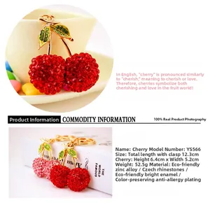 Detail view of cherry keychain featuring red rhinestones and green zinc alloy leaves