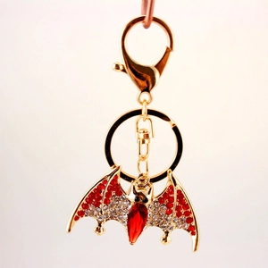 Creative cute bat keychain with red and white crystals on golden metal pendant