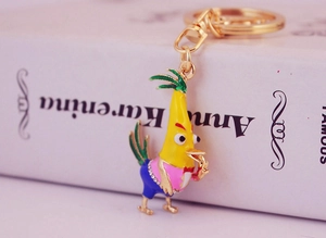 Detail shot of a creative cartoon rooster keychain with colorful enamel and crystal accents
