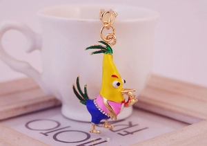 Detailed view of yellow cartoon chick keychain with enamel finish and crystal rhinestones