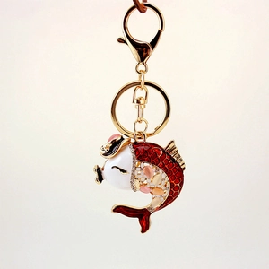 Exquisite koi fish keychain with red and white enamel finish and colorful rhinestones