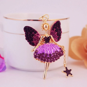 Porte-clés ange féerique doré avec strass violets et pendentif étoile sur une tasse
