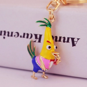 Cute cartoon rooster keychain with rhinestones and enamel finish on white background