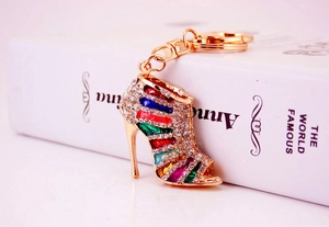 Macro view of crystal rhinestone high heel shoe keychain with gold metal lobster clasp