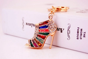 Close-up of golden rhinestone high heel keychain with vibrant multi-colored crystals