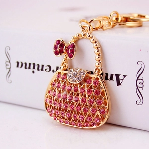 Portachiavi borsa con strass rosa in lega oro rosa e fiocco in cristallo lucido