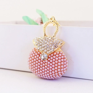 Pink pearl and rhinestone handbag keychain charm with golden metal handle and crystals