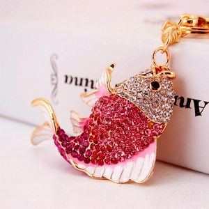 Golden koi fish keychain pendant with pink rhinestones and white enamel finish