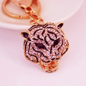 Creative sparkling leopard head keychain with rhinestones and black enamel detail on gold metal