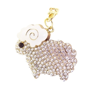 Sparkly rhinestone sheep keychain with gold metal plating and white enamel detailing