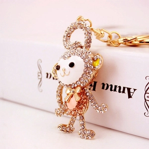Sparkling crystal encrusted monkey keychain in gold alloy for handbags and car keys