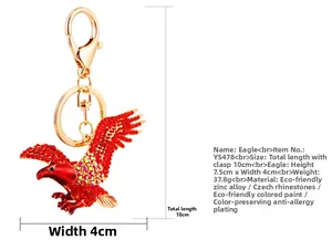Macro shot of 10cm eagle keychain with red crystals and gold-plated zinc alloy