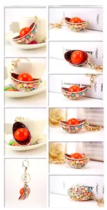 Detailed views of gold ingot keychain with multi-color rhinestones and metal hook
