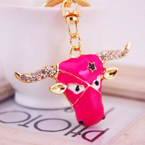 Chic pink cow head keychain with white rhinestones and golden metal ring pendant
