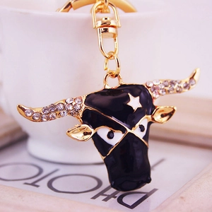 Bull head keychain with black enamel, sparkling rhinestones and gold metal finish