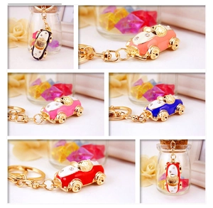 Close-up of colorful car keychains with zinc alloy finish and rhinestone details
