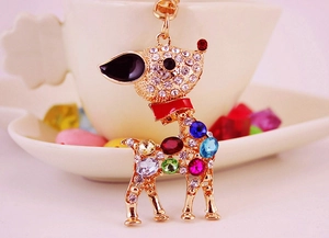 Close-up of golden deer keychain with multicolored rhinestones and lobster clasp